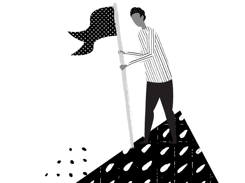 person planting flag on top of mountain